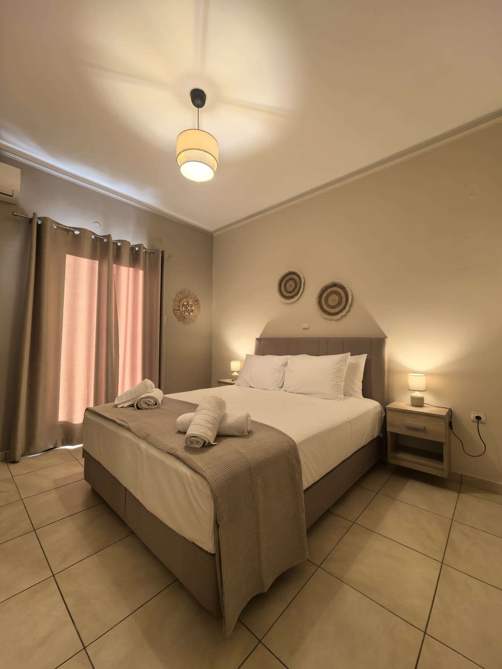 Furnished bedroom in a Syros long-stay rental — monthly living on the island